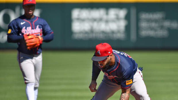 Braves infielder Leury Garcia (#63) scoops up a ground ball during a fielding drill Tuesday, Feb. 20, 2024 at CoolToday Park in North Port, Florida.  